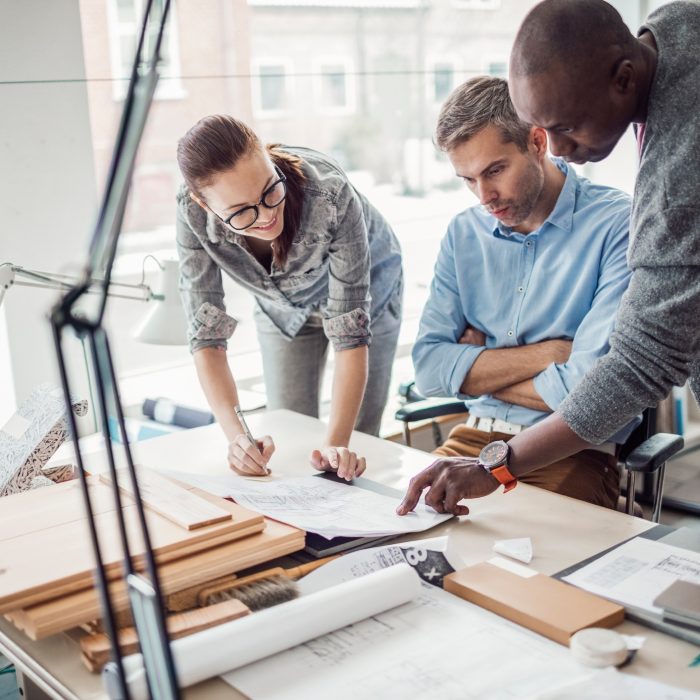 Close up of architects working together on  project